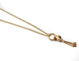 Gold Necklace with Rings and Dangling Chain